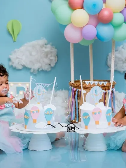 These twin girls are having the best time during their hot air balloon cake smash. We ensure there's a cake for each of them to enjoy.