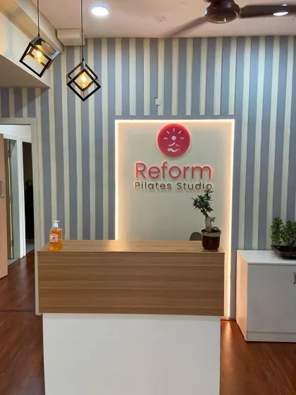 The backlit studio logo at our reception is a small detail that reflects the modern and sophisticated feel of the space.
