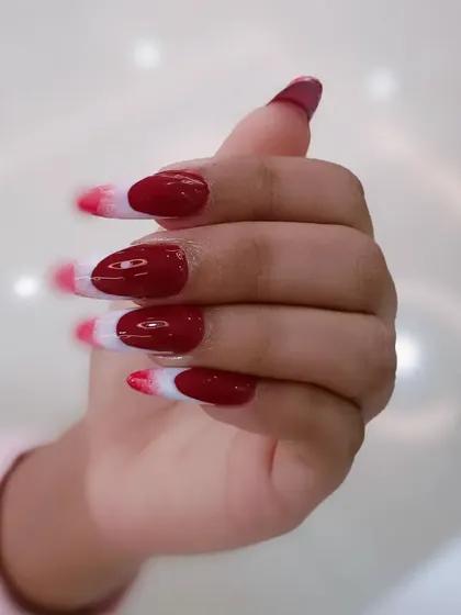A hand-held view of the unique red and white ombré design.