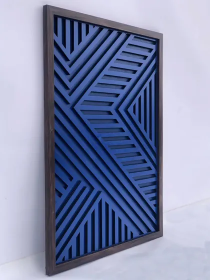The play of light and shadow is evident in this side view, emphasizing the 3D nature of the geometric wood art.