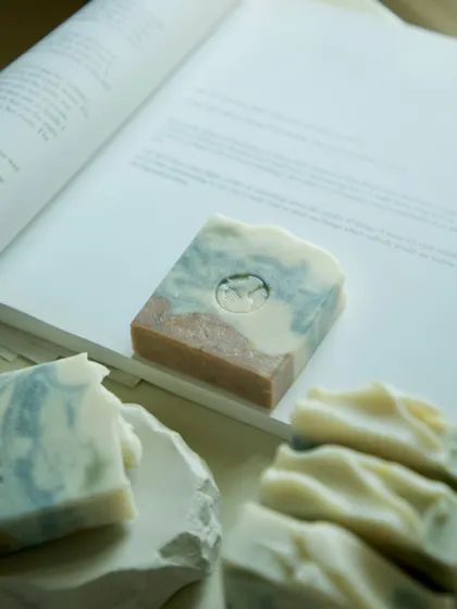 This is my Lavender, Rosemary & Peppermint bar, a skin-loving powerhouse enriched with indigo powder, hibiscus powder, and kaolin clay. And yes, there’s a tiny dolphin swimming in there.