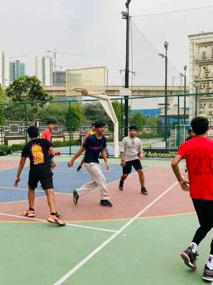 Players moving the ball around the perimeter, looking for an open shot.