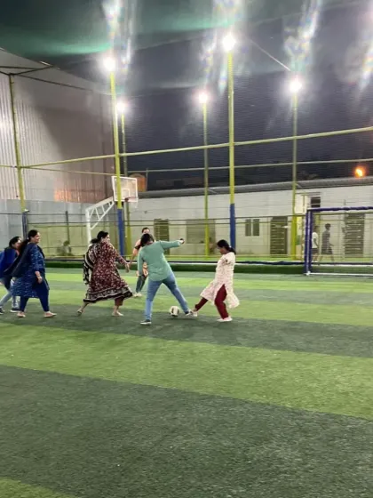 Another shot of the women's game at our community fest, showcasing the fun and inclusive atmosphere we cultivate.