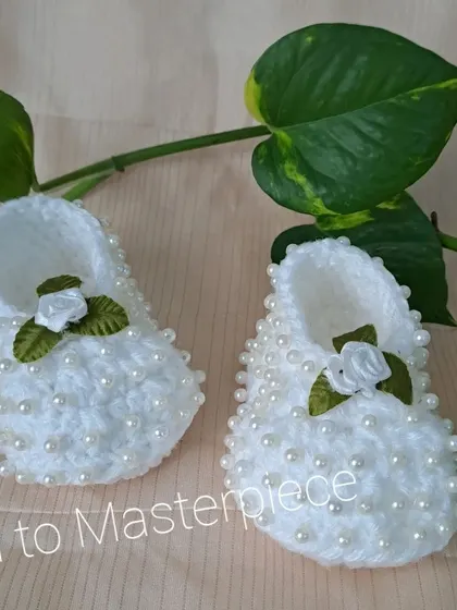 These white booties are fully embellished with pearls and feature a small white satin rose, combining two of my most popular decorative elements.