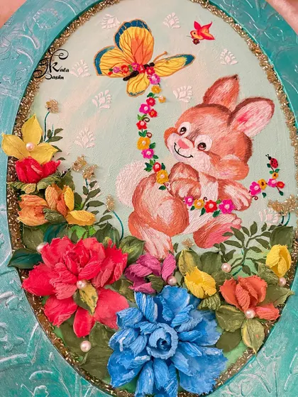 A detailed view of the bunny and the surrounding floral garden.