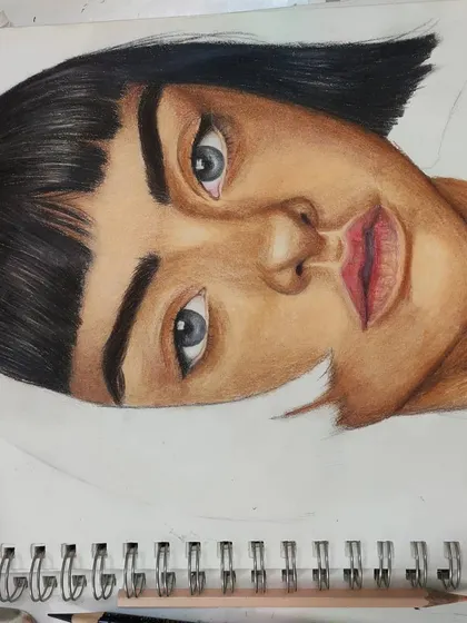 An angled WIP shot of the same portrait, showing the shading on the face.
