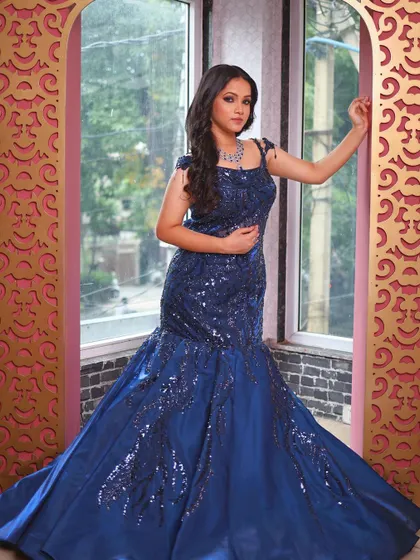 Another full-length shot of the blue fish-cut gown, showcasing its beautiful silhouette.
