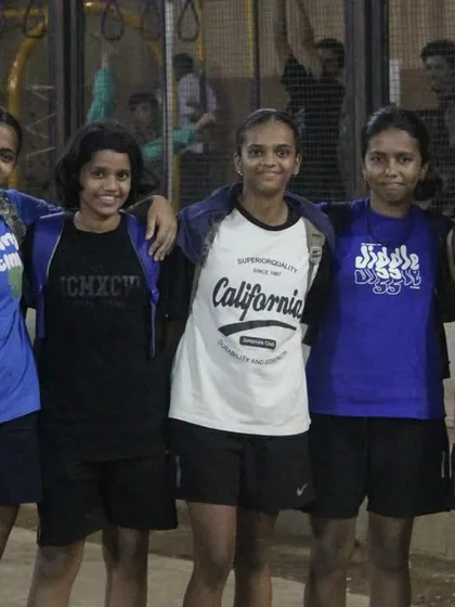 A group of players from our women's division posing for a photo after a match.
