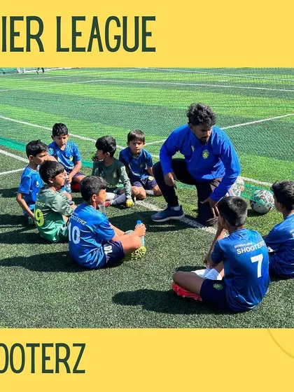 The coach gives last-minute instructions to the U-9 team, a crucial part of their development.