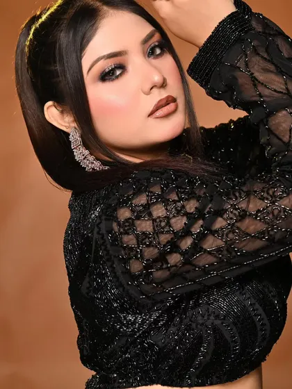 A perfect example of a night party makeup look from a student's portfolio. The dark, smokey eye and contoured cheeks are ideal for evening events.