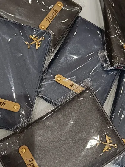 More custom passport covers with names like Harsh and Apoorv, ready for gifting.