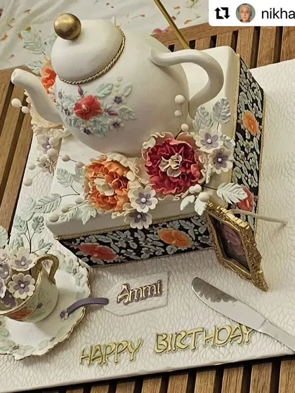 A closer look at the exquisite teapot cake created for Aamir Khan's mother. The design features a hand-painted floral pattern on the teapot and a delicate sugar teacup, all inspired by her personal style.