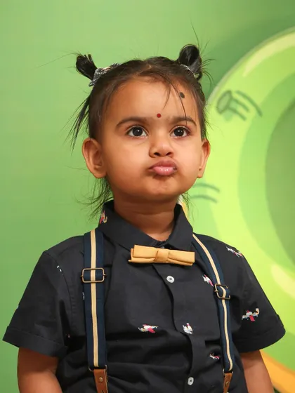 Another adorable shot of the birthday girl, this time with a perfect pout. Capturing these cute, fleeting expressions is what makes kids' photography so special.
