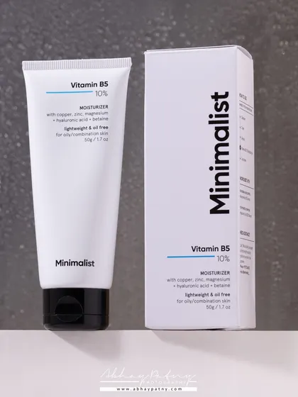 A clean, minimalist product shot for a skincare brand. The simple composition and neutral background reflect the brand's "minimalist" identity and focus on the product's key ingredients.