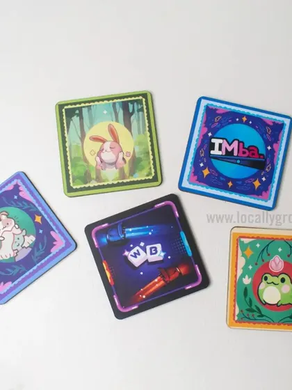 Protect your desk in style with these custom-designed tea coasters. This set features unique, colorful illustrations, showing the creative possibilities for even the smallest gift items.