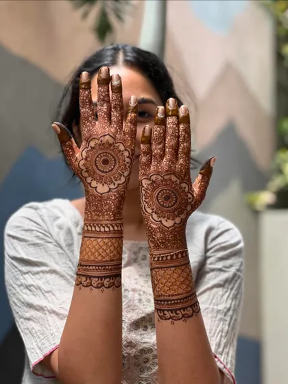 A playful shot of a client with her semi-bridal mandala mehendi.