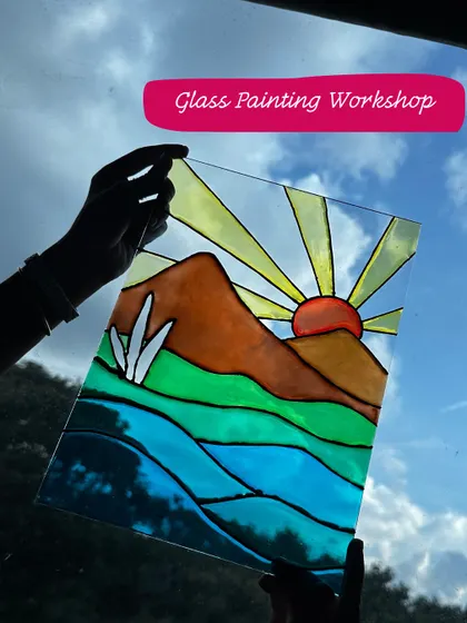 A stunning glass painting held up to the sky. This technique creates a beautiful stained-glass effect, with colors that come alive in the light.