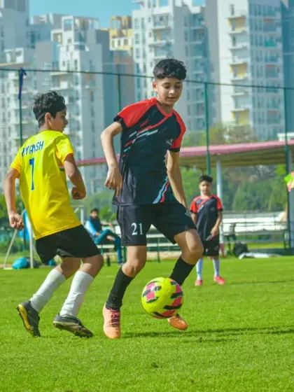 Navigating a crowded field, this player demonstrates excellent close control and awareness.