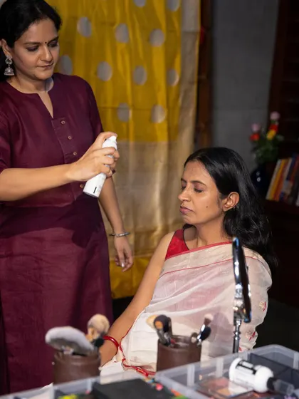 Applying setting spray during a makeup demonstration at a workshop. My goal is to teach techniques that help women feel beautiful and confident in their own skin.