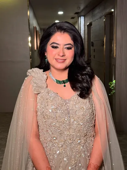 A close-up of Sanchi's engagement makeup. The shimmery eyes and soft pink lips create a look of youthful elegance.