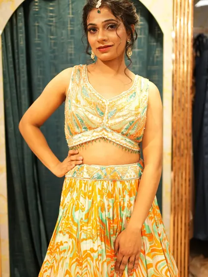 A closer look at the printed Haldi lehenga. The beaded blouse adds a touch of glam to this otherwise playful and comfortable outfit.