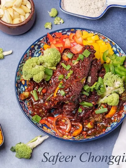 Our take on the classic Chongqing Chicken, this dish is known for its fiery and numbing spice. Crispy chicken pieces are stir-fried with a medley of spices, bell peppers, and broccoli for a bold flavor experience.