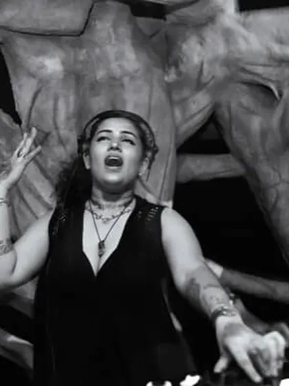 A dramatic black and white shot of me singing along to a track in Goa.