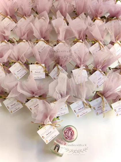 A full view of 40 peony votive jar candles in purple, beautifully packaged for Areena's First Holy Communion.