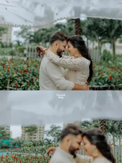 An intimate pre-wedding moment, with the couple sharing a close embrace under a delicate white dupatta, creating a soft and dreamy portrait.