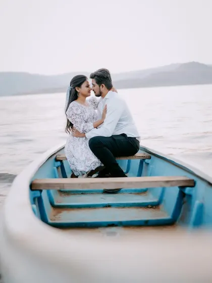 A romantic boat ride is a perfect setting for a pre-wedding shoot. It’s quiet, intimate, and allows for beautiful, reflective photos.