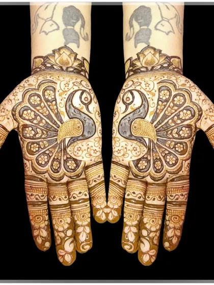 The peacock is a timeless symbol of grace and beauty in mehndi art. Here, I've created a design where two majestic peacocks form the centerpiece, surrounded by delicate floral patterns for an elegant look.