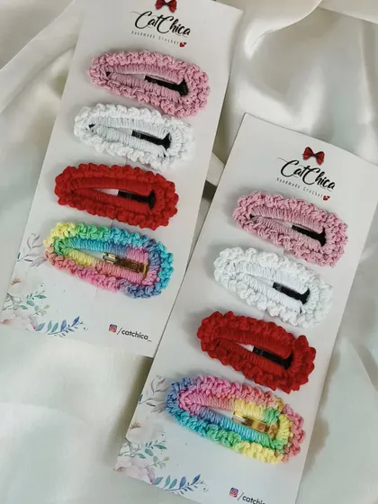 A set of four simple crochet clips, including a rainbow one. Easy to wear and affordable.