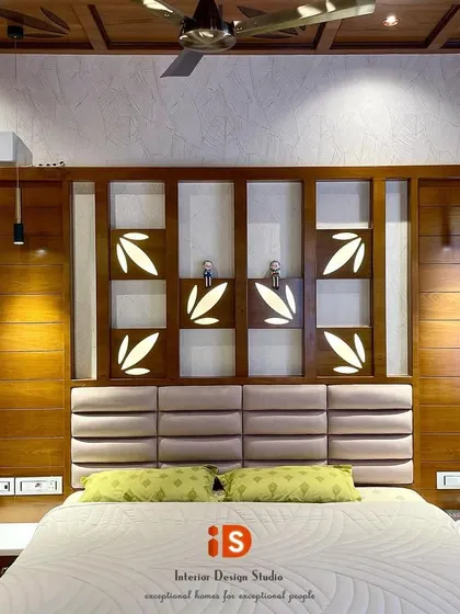 A close-up of the intricately designed headboard in the traditional bedroom, with its backlit CNC-cut panels and warm pendant lights.