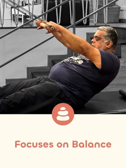 Pilates focuses on balance, which is crucial for preventing falls and improving coordination. Exercises like this one on the tower system challenge and improve your stability in a controlled environment.
