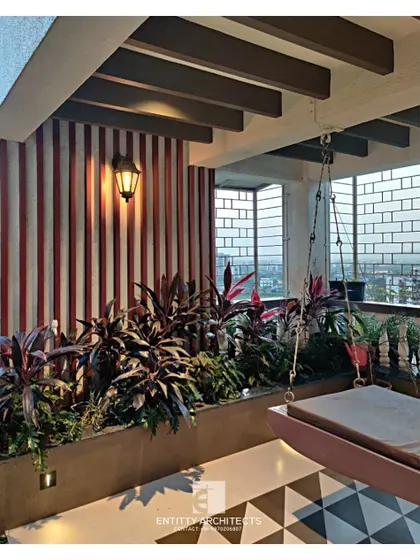 I transform outdoor areas into relaxing extensions of the home. This terrace features a comfortable swing, lush planters, and patterned floor tiles, creating a perfect urban oasis for unwinding.