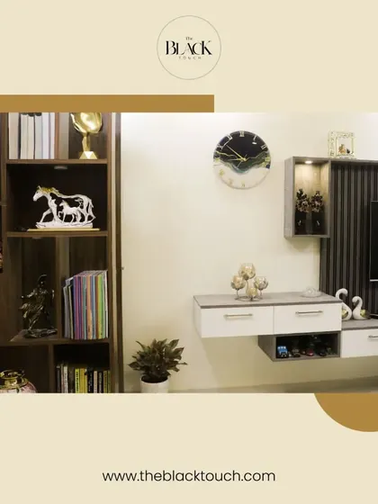 A well-organized TV unit and bookshelf combination. This design provides ample storage and display space while maintaining a clean and modern look.