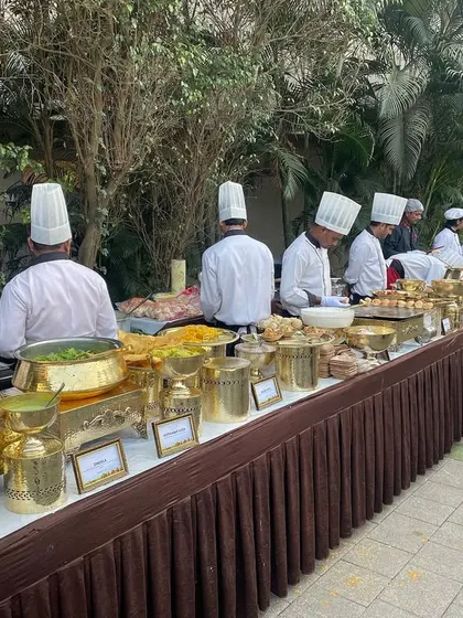 A wide view of our Hi-Tea buffet line at Novotel Imagica. Our team of chefs works together to ensure a seamless and abundant supply of fresh, hot food for all your guests.
