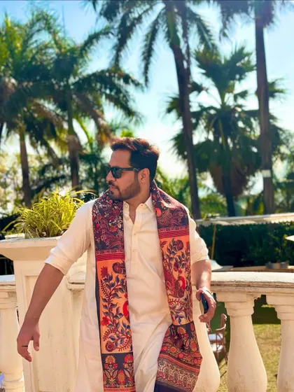 A profile shot against the palm trees, capturing the beautiful ambiance of a destination wedding.