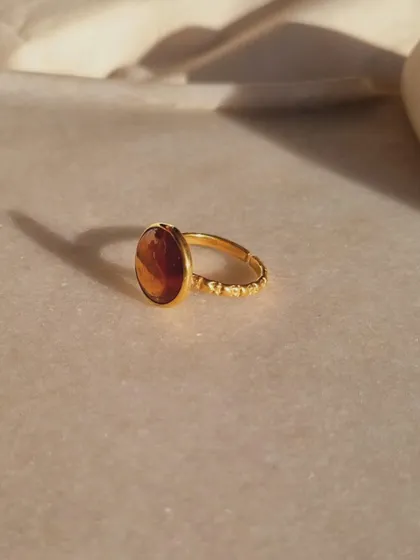 A close-up of the Hessonite Garnet Sun Ring. I designed this piece to be a beacon of abundance and prosperity.