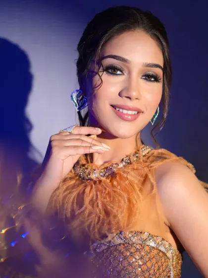 This glamorous look with a feathered top and smokey eyes is perfect for a cocktail party or sangeet. It's bold, modern, and makes a statement.