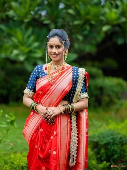 A classic Maharashtrian bride in a radiant red Paithani Nauvari. I styled this entire look, from the precise drape and minimal makeup to the traditional mundavalya and jewelry, ensuring she felt both royal and comfortable on her big day.