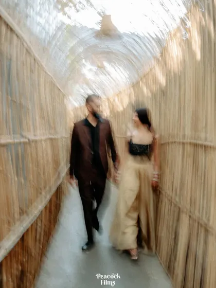 An artistic motion-blur shot of the couple, adding a dynamic and dreamy feel to their cocktail party portraits.