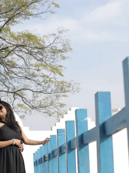 Using the lines of this blue fence, I framed the couple to create a visually interesting and intimate pre-wedding portrait. It's about finding creative angles in any location.