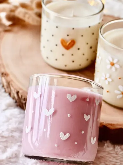 These hand-painted jar candles are a charming and whimsical addition to any space. The heart and daisy designs are perfect for gifting.