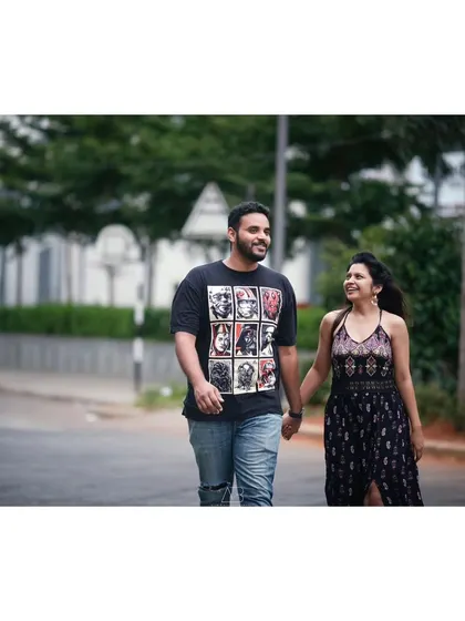 A simple, happy moment of a couple walking hand-in-hand. These are the unposed, in-between shots that often become the most cherished memories.