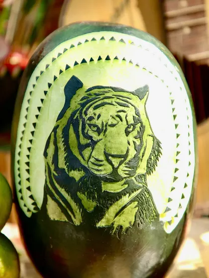 Another example of my team's carving skills, with a tiger's face intricately carved into the rind of a watermelon.