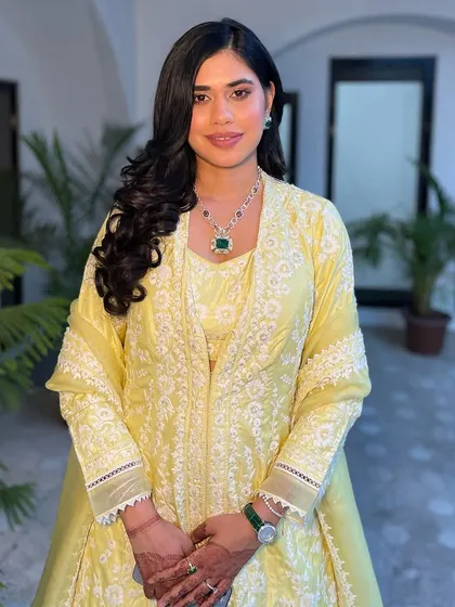 The full look, showing how the simple hairstyle balances the detailed outfit.