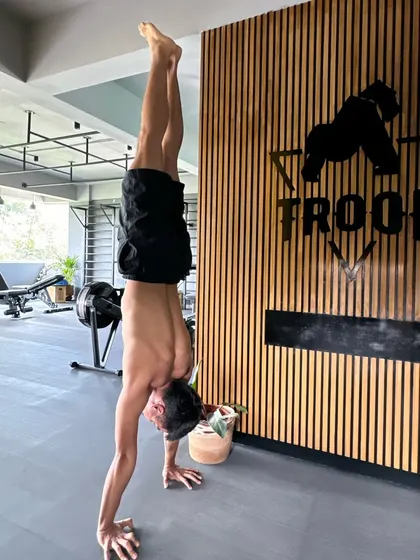 Closing out the year with a handstand in front of the Troop logo. I'm grateful for all the personal and professional milestones achieved here.