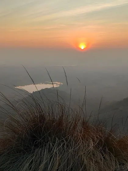 A breathtaking sunrise view from the top of Uttari Betta. This trek also includes the thrill of rappelling.