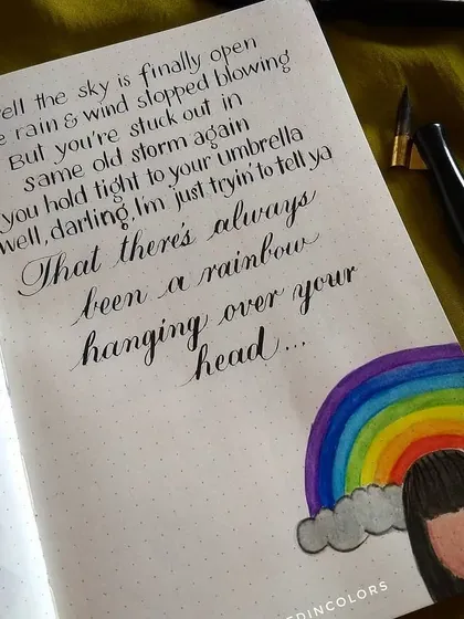 This was the original art journal piece that inspired the custom birthday card. It features lyrics from Kacey Musgraves' song "Rainbow," combining pointed pen calligraphy with a watercolor illustration.